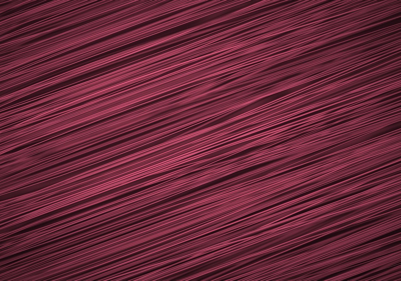 Close view of masterbatch-dyed maroon polypropylene filaments